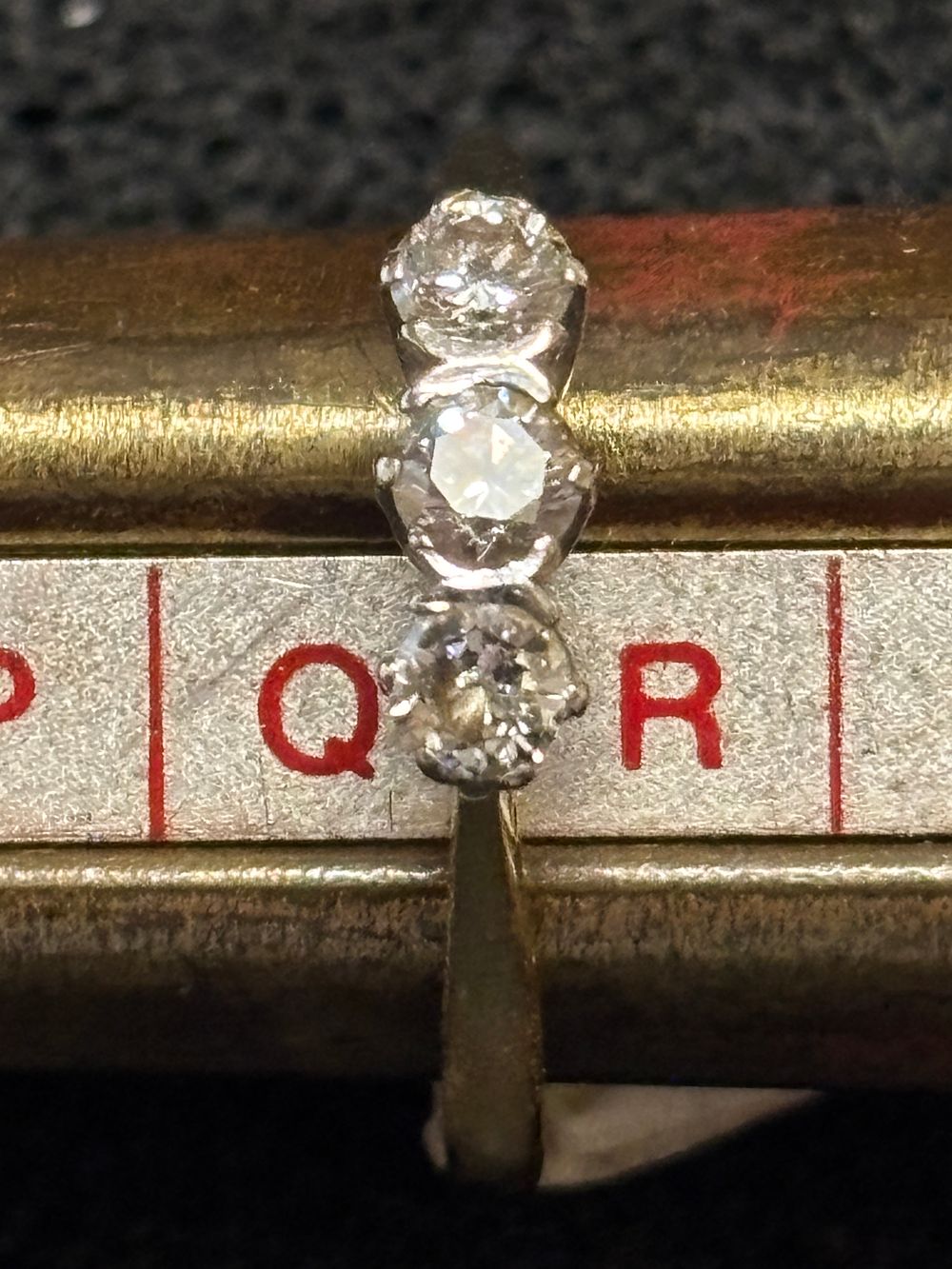 An 18ct Gold ring with three diamonds 0.5pts 3.44gm