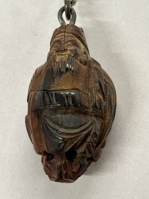 An intricate carved nut on a 22 inch 925 chain