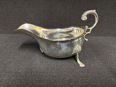A Mappin and Webb sauce boat which has a broken foot as shown weighing 173.13 gm
