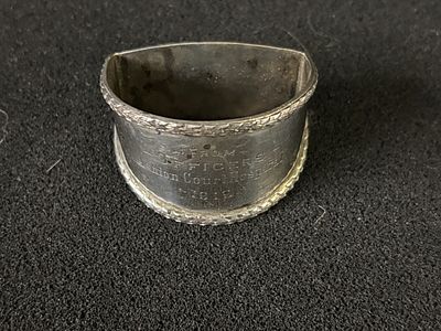 A HM Silver napkin ring presented in 1919 by the Officers of the Ashton Court Hospital weighing 