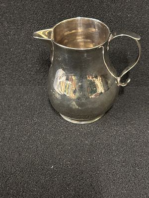 A small HM Silver cream jug weighing 70.70 gm