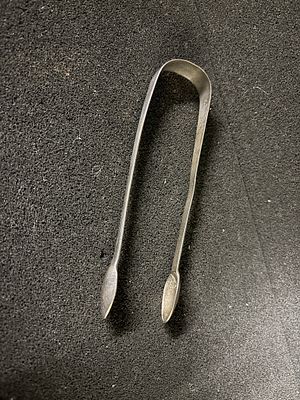 A pair of HM SIlver tongs, 14.5 cm long weighing 28.23 gm