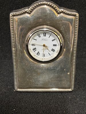 A HM silver clock Sheffield 1995 being 10cm tall