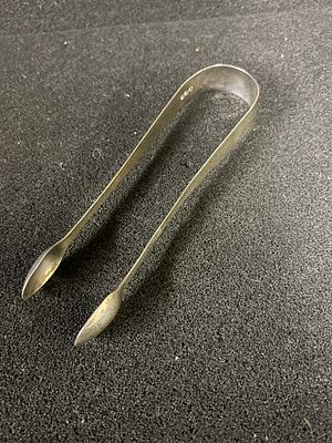 A pair of HM silver sugar tongs (approx 15cm long) weighing 30.24 gms