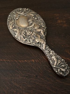 A Joshua Reynolds style HM Silver hand mirror
