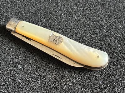 A HM Silver and Mother of Pearl fruit knife measuring 8 cm