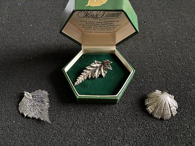 Two delicate leaf brooches (one sterling silver Flora Danica from Copenhagen in original gift 