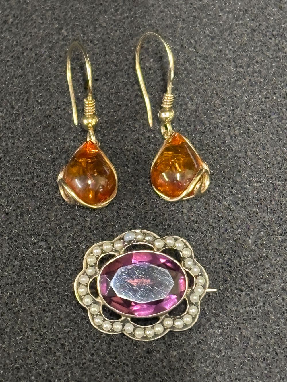 A Silver gem set pendant with seed pearls together with a pair of earrings