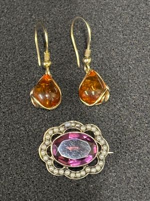 A Silver gem set pendant with seed pearls together with a pair of earrings