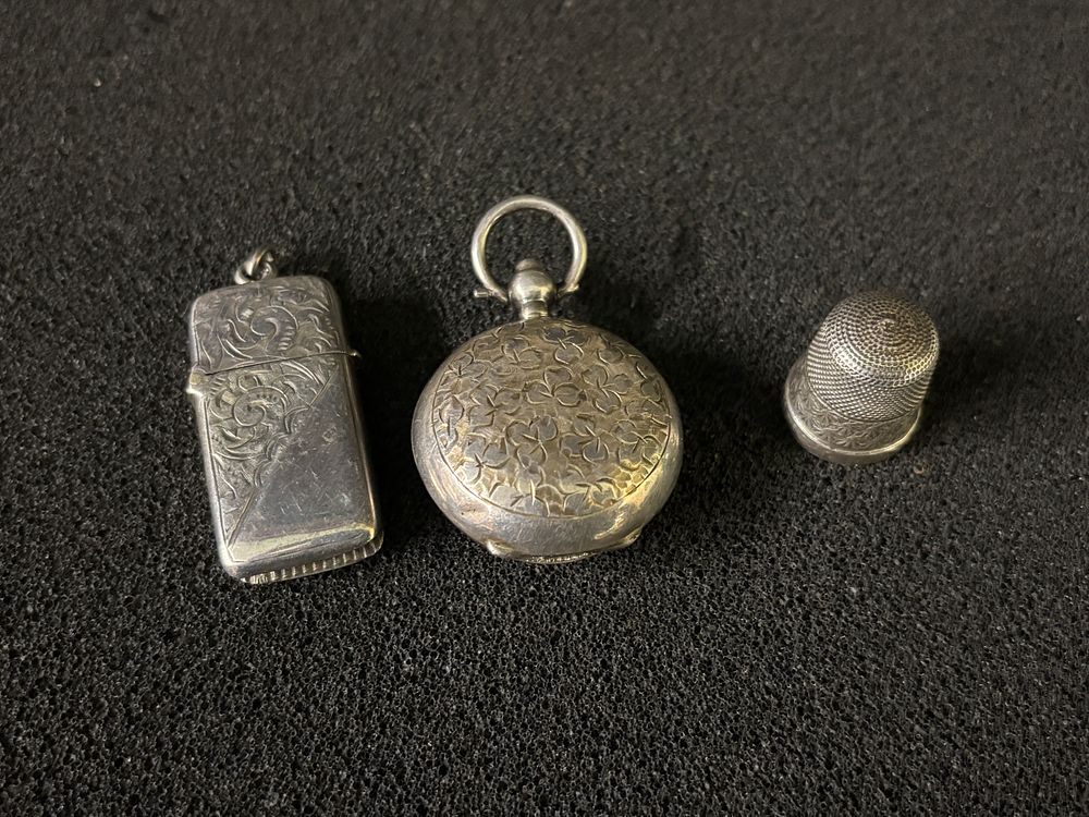 Three pieces of HM Silver to include, A Vesta, thimble and coin holder. Total weight 22.78 gm