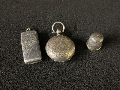 Three pieces of HM Silver to include, A Vesta, thimble and coin holder. Total weight 22.78 gm