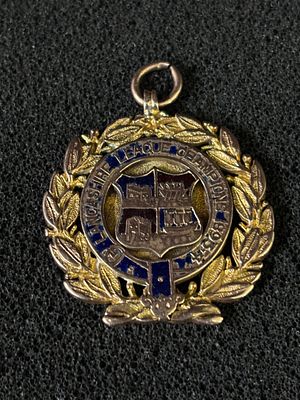 A HM 9 ct Gold and enamel football medal (Made by Shiers &amp; Co) Blackpool, awarded to 