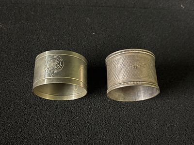 Two napkin rings one having a silver Hallmark which weighs 19.6 gm