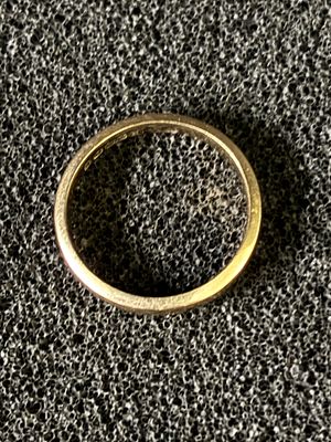 A 9ct gold wedding band size J 1/5, weighing 2.15 gm