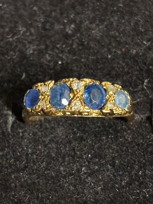 An 18 ct gold gem set ring set (one stone is a slightly different colour). Size M 1/2 and 