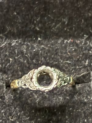 An 18 ct Gold ring (missing stone) size K 1/2 weighing 2.37 gm