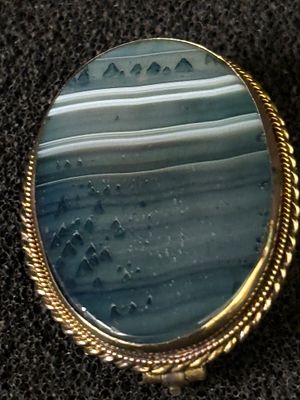 A blue agate and gold brooch - pendant which has been tested