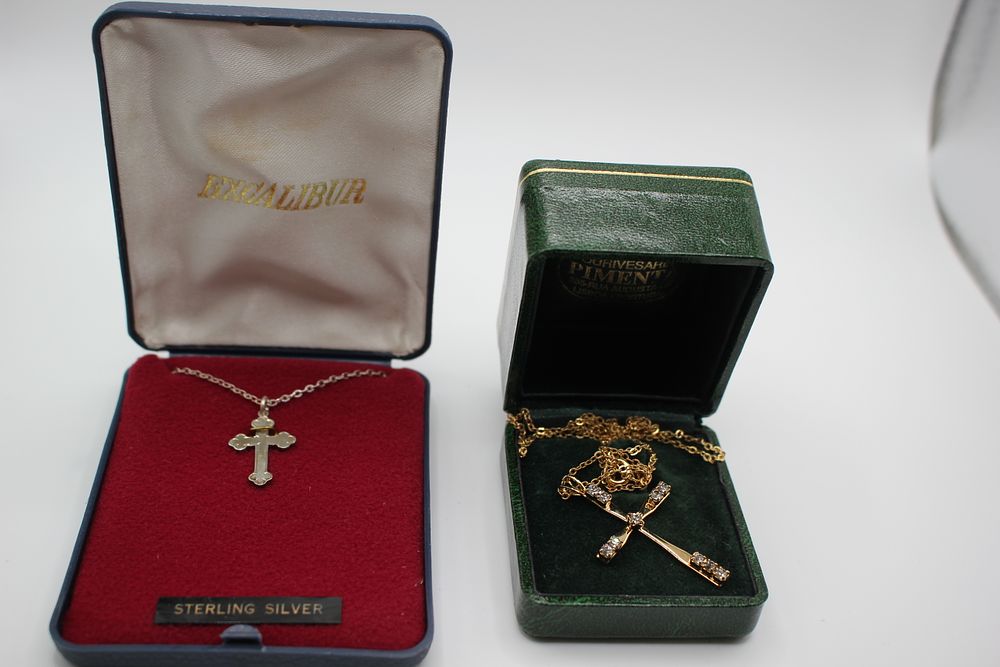 Sterling silver cross and chain plus another set with clear stones, in boxes