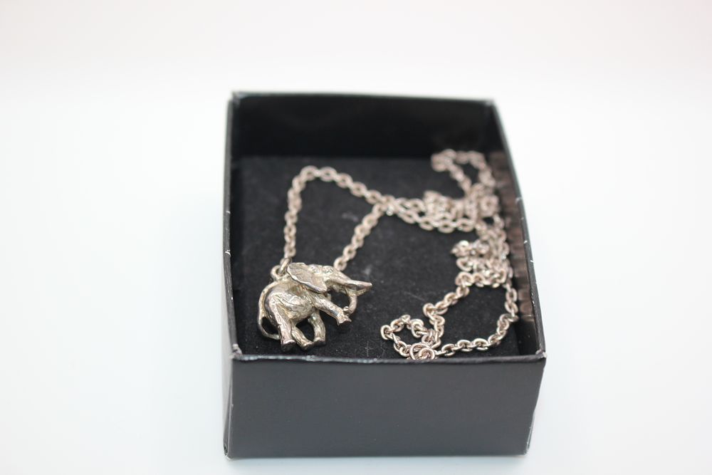 A silver elephant pendant and chain by Harriet Glen