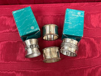 A Set of Four Selwin Pewter Napkin Rings. A set of four cast pewter napkin rings by Selwin 