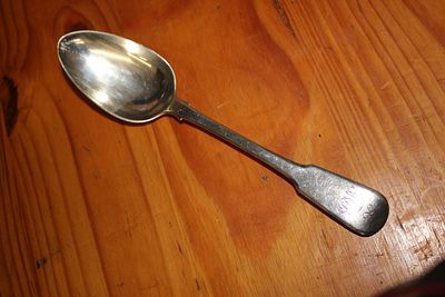 A HM silver tablespoon weighing 76.37 gm