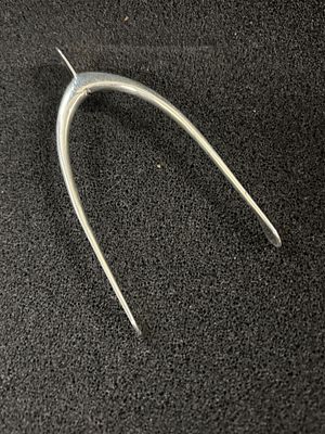 A HM Silver hinged Wishbone, measuring 11.26 gm