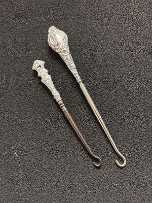 Two silver handled button hooks a/f