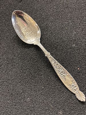 A Sterling Silver souvenir spoon weighing 24.71 gm