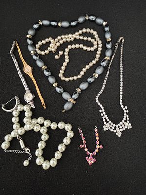 An Assortment of Vintage Costume Jewellery and Ladies' Wristwatches. An assortment of 