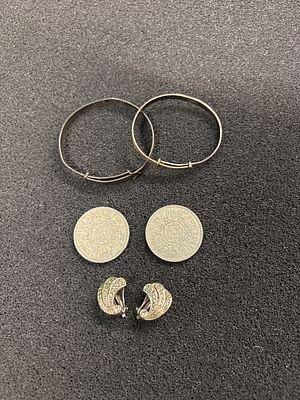 Two silver child's bangles, a pair of earrings and two coins