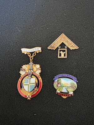 Three 20th-Century British Masonic Jewels including a 1954 RMIG Steward Medal. A trio of 