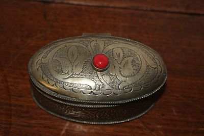 A Late 19th or Early 20th-Century Silver-Plated Oval Trinket Box with Red Cabochon. This small 