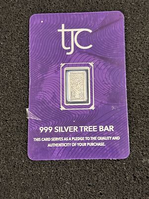 A 1 Gram .999 Fine Silver Tree Bullion Bar for TJC. A 1-gram silver bullion bar presented in its 