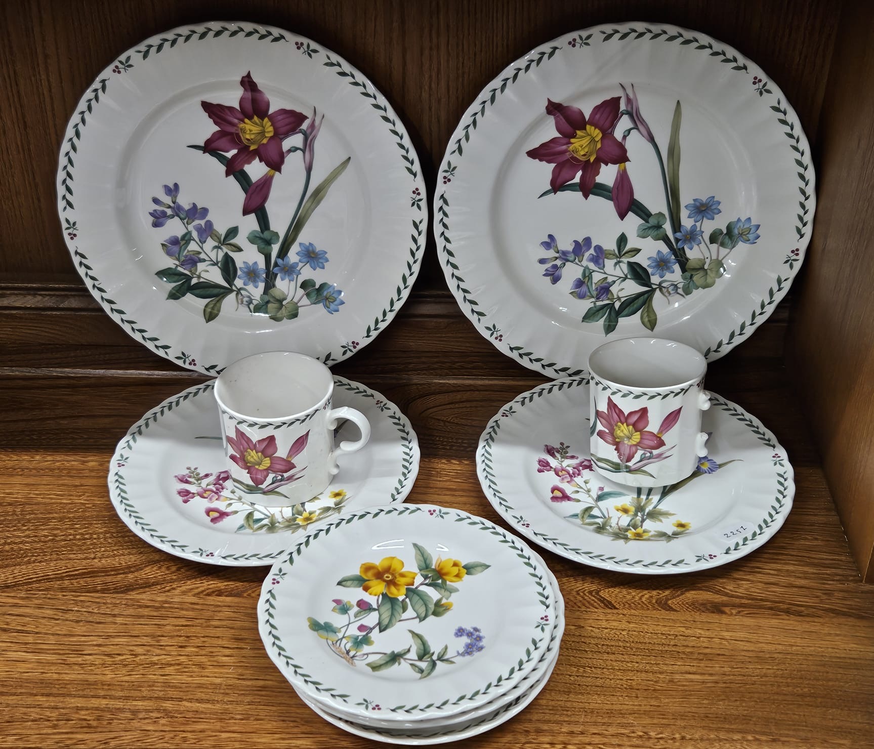 A Group of Ceramic Tableware with Floral Decoration and Foliate Borders