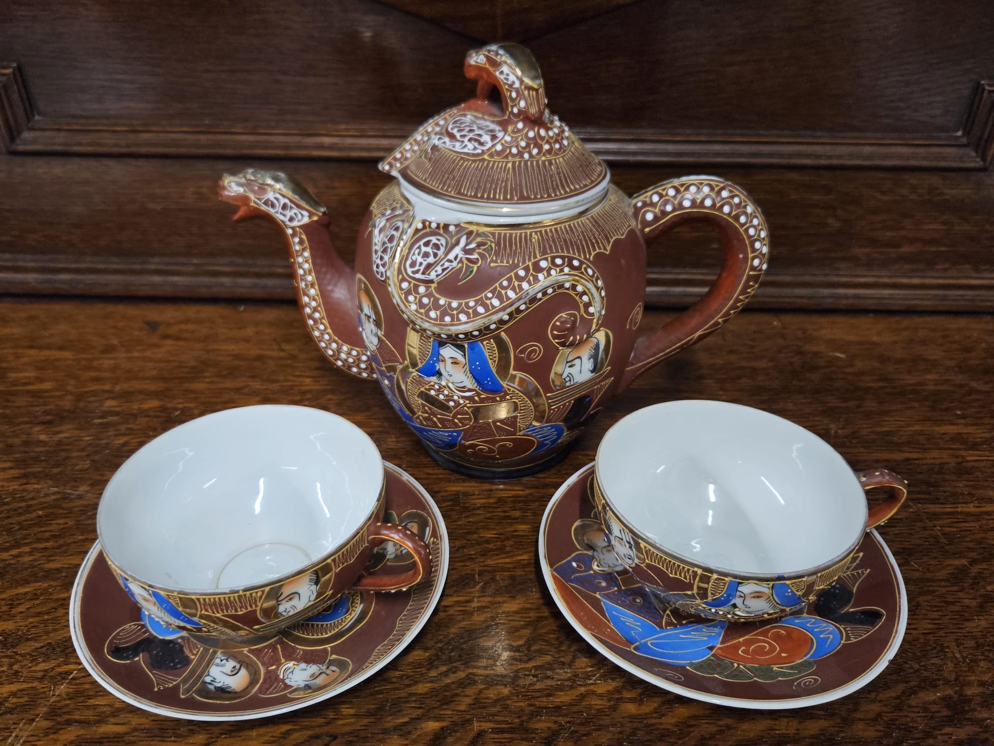 A Three-Piece Japanese Moriage Porcelain Dragonware Tea Service