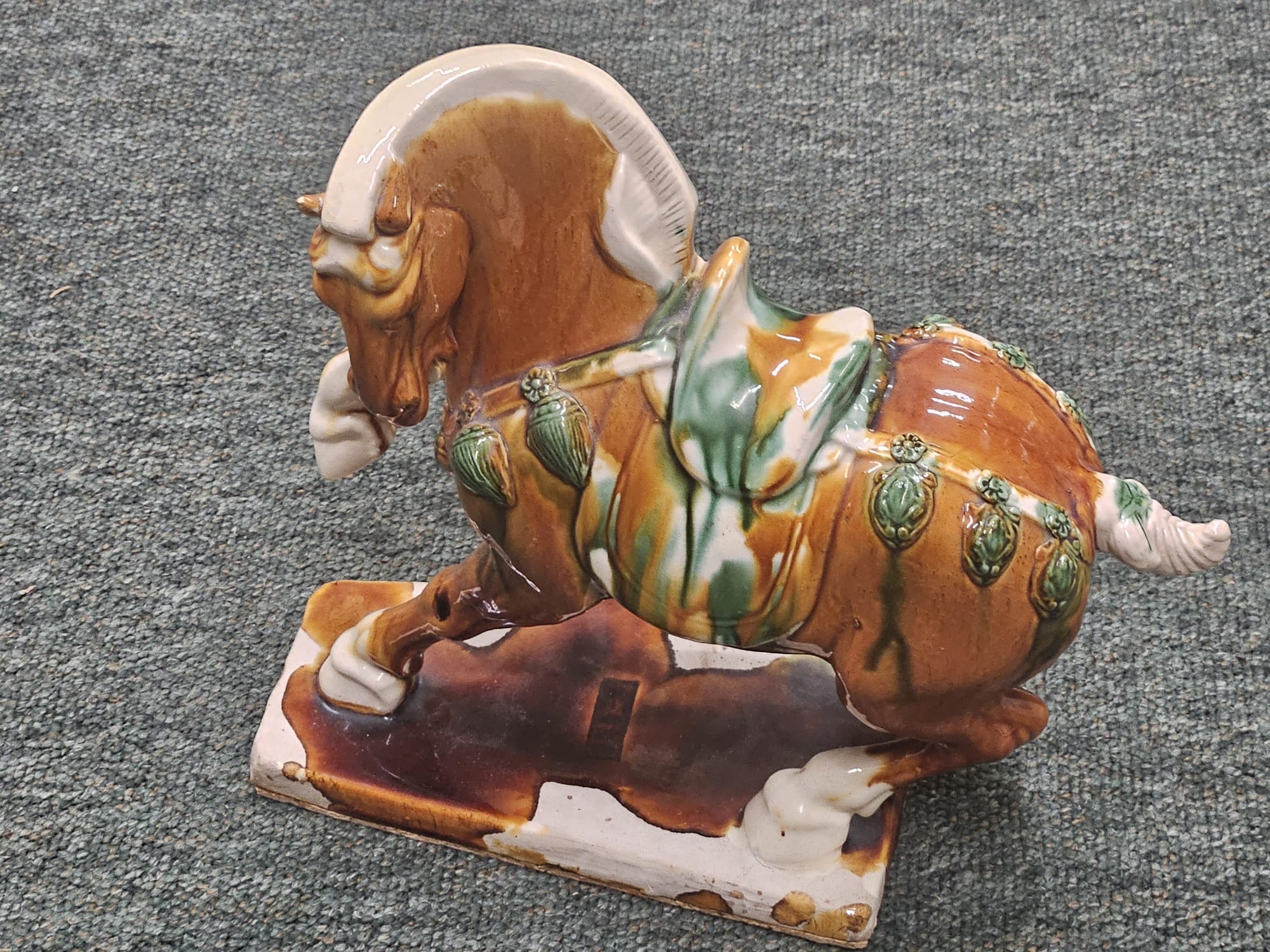 A Sancai glazed ceramic horse figurine