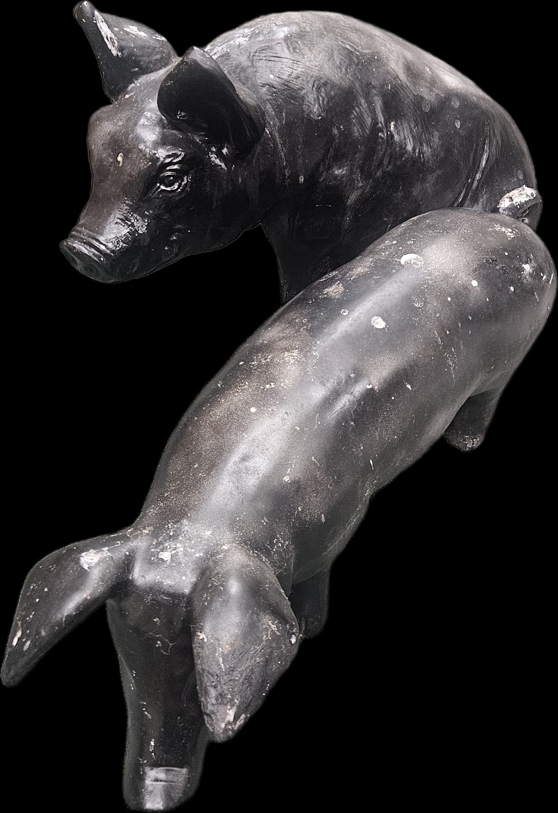 A pair of stylised black resin pig garden ornaments c 38 cm tall