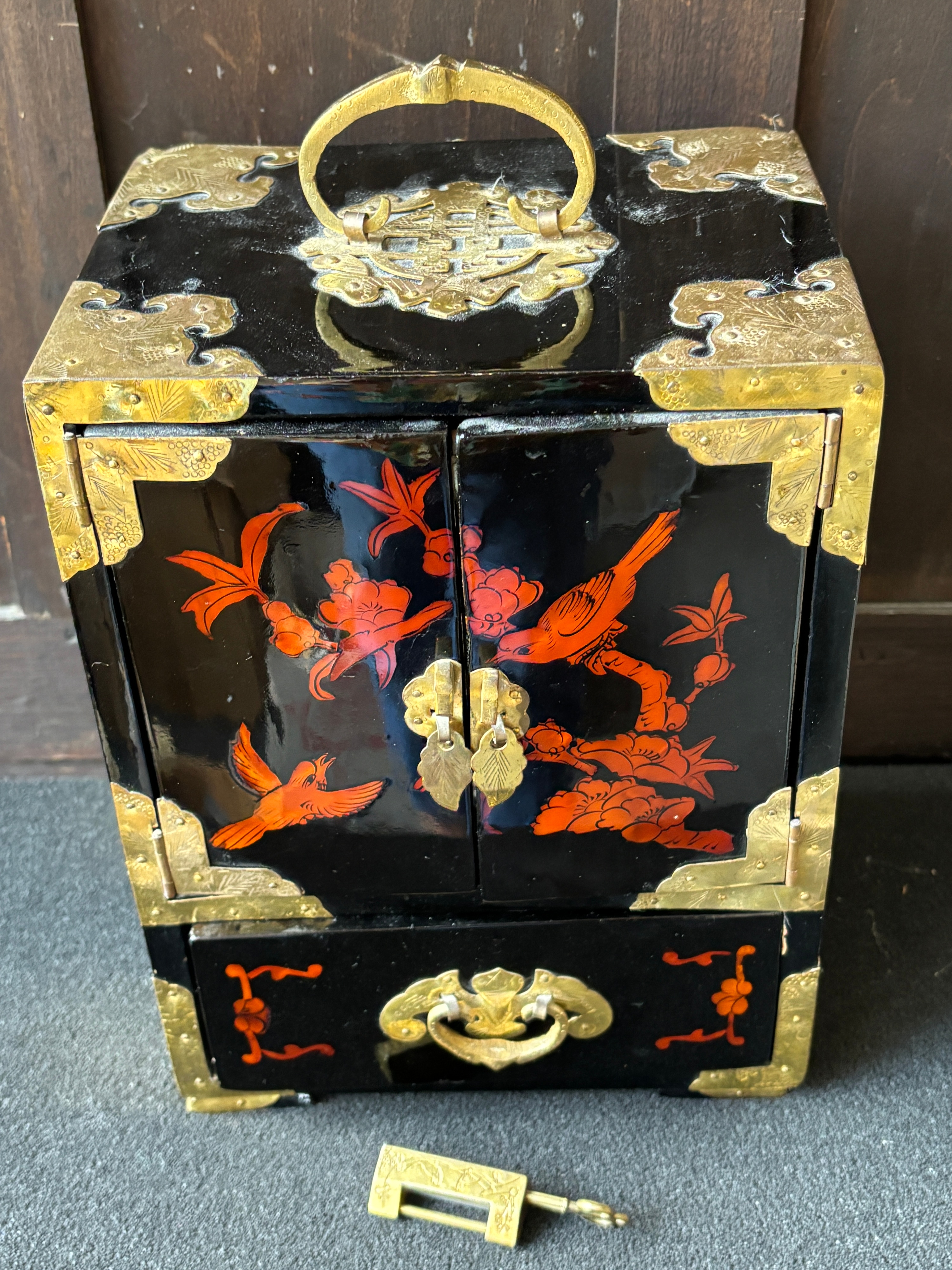 A Chinese Black Lacquer and Brass Mounted Jewellery Cabinet