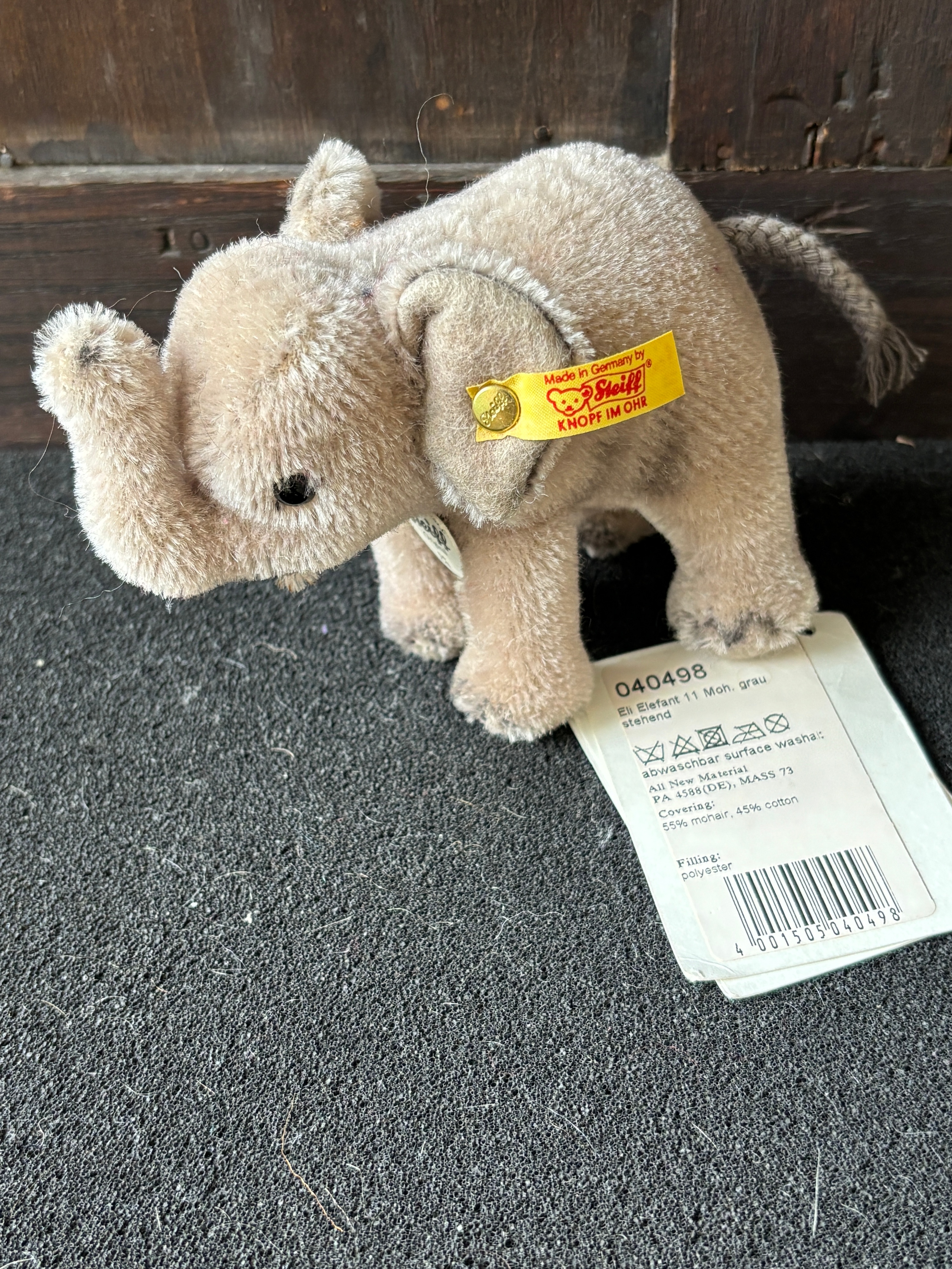 A Steiff Eli Elefant standing plush toy with original tags