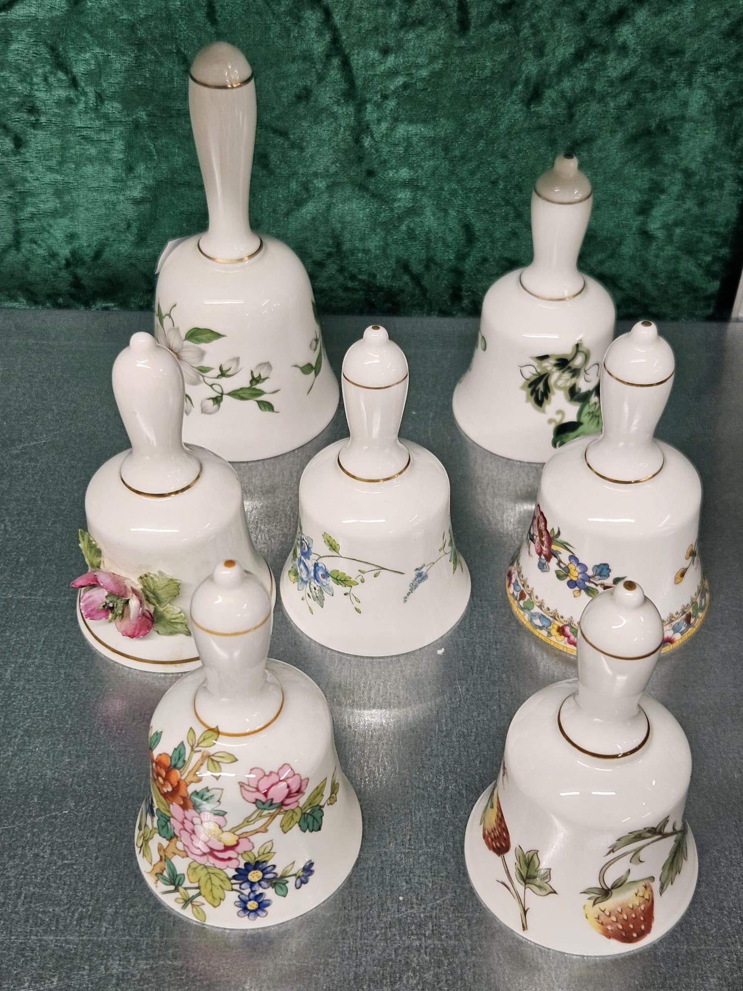 A Set of Seven Coalport Bone China Floral and Fruit Decorated Bells