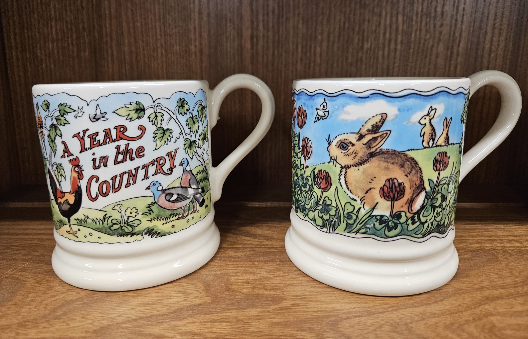 A pair of Emma Bridgewater earthenware half-pint mugs designed by Matthew Rice