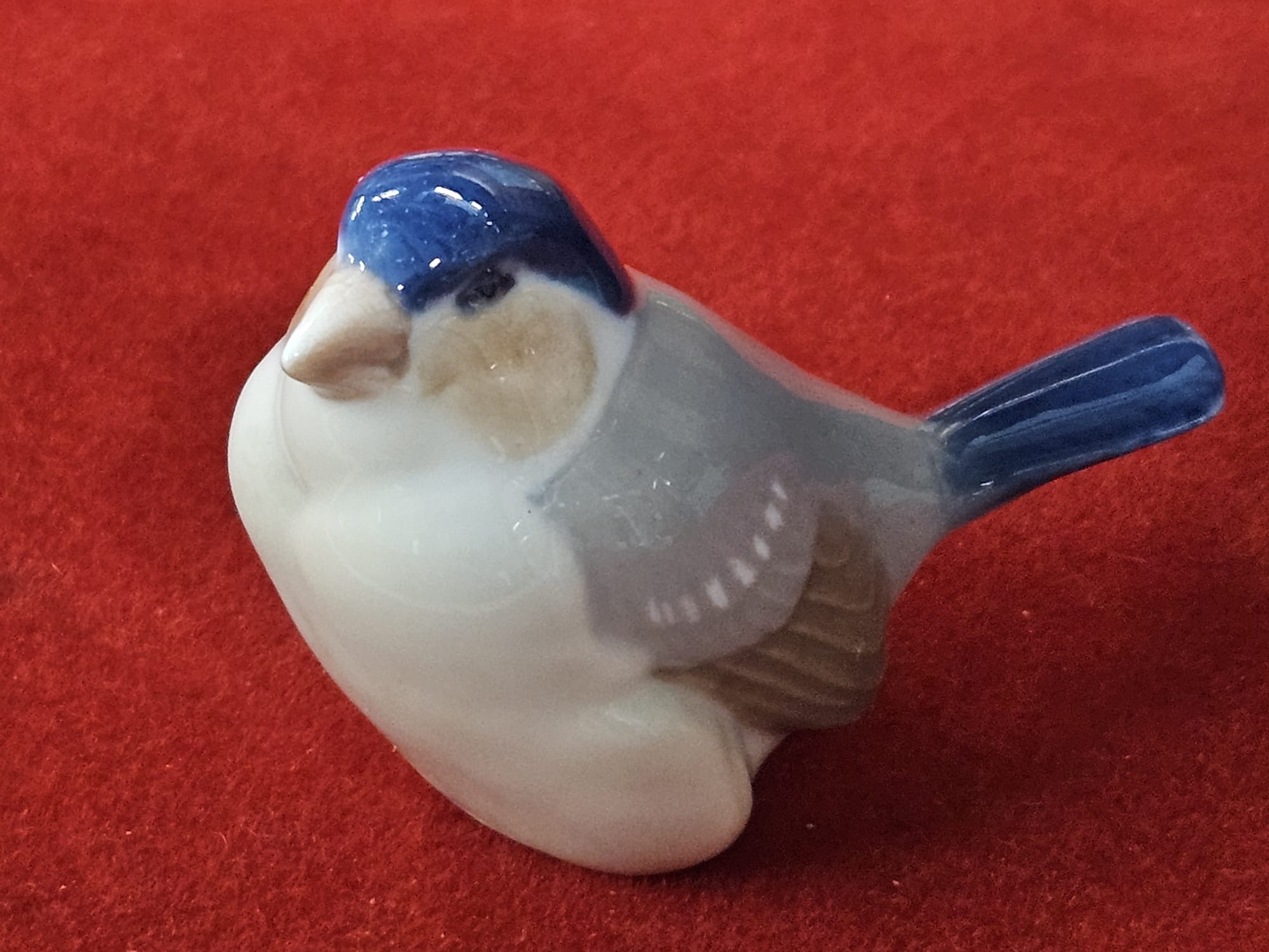 A Royal Copenhagen glazed porcelain finch figurine model 1040