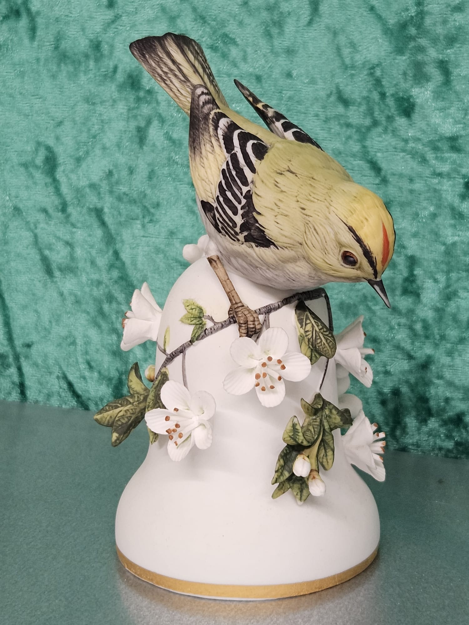 A Franklin Porcelain Goldcrest bird bell designed by Peter Barrett dated 1980