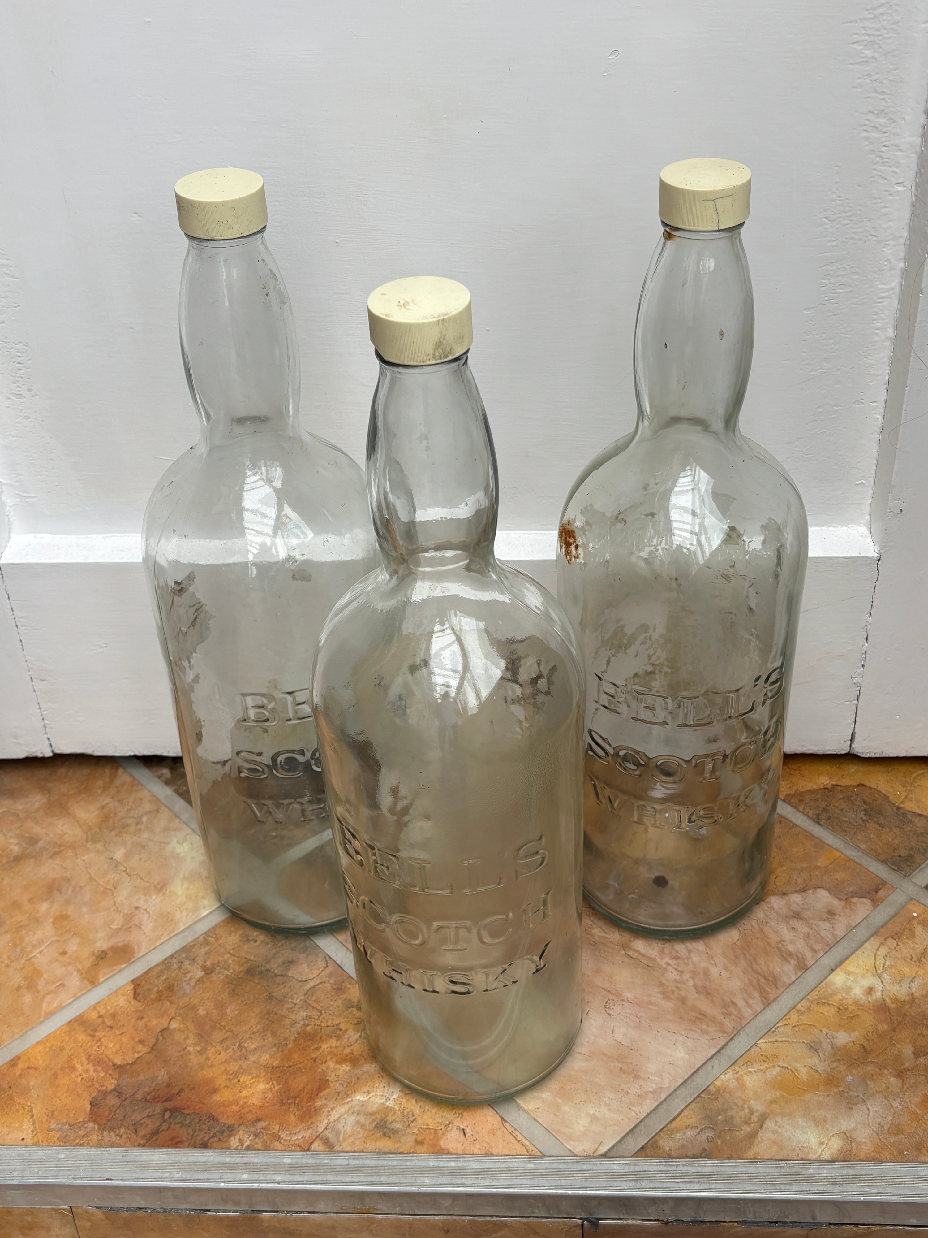 A Trio of Vintage Bell's Scotch Whisky Bottles