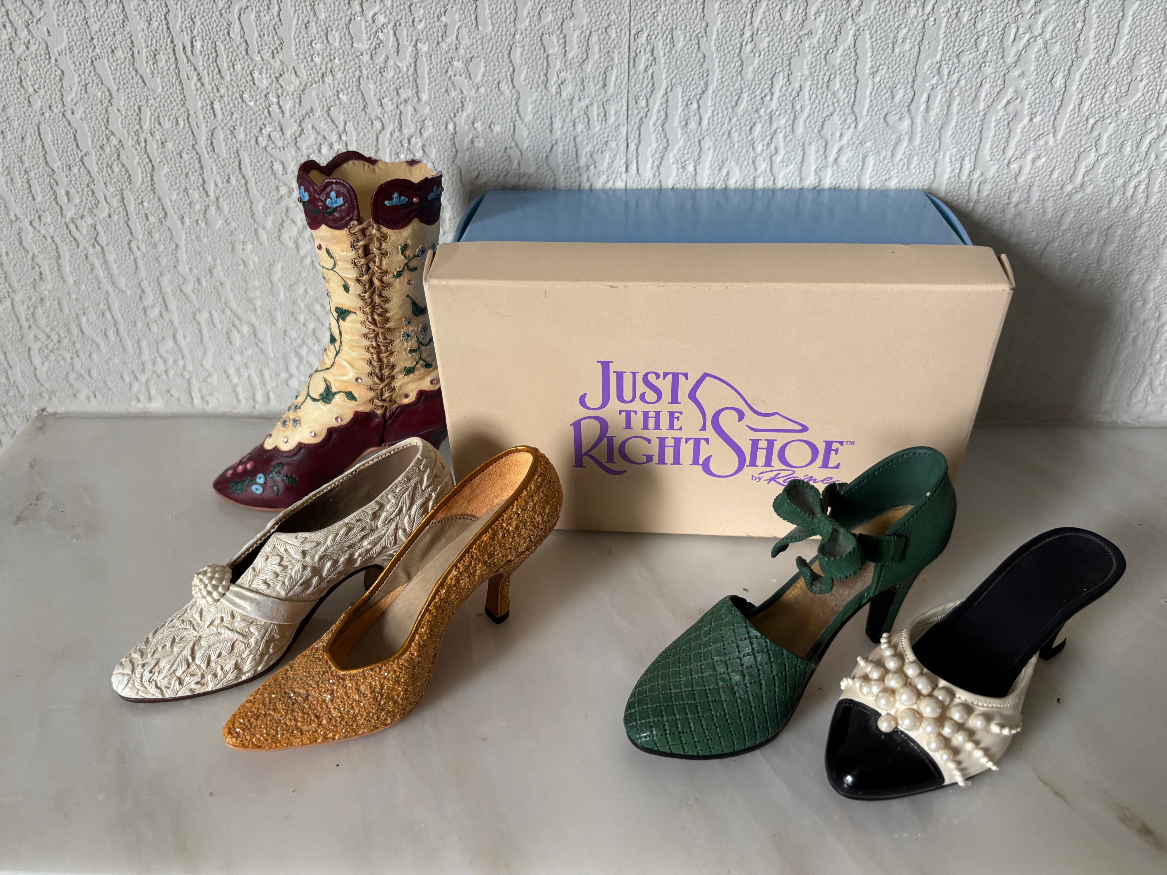 A Collection of Five Just the Right Shoe by Raine Miniature Shoe Figurines and Box