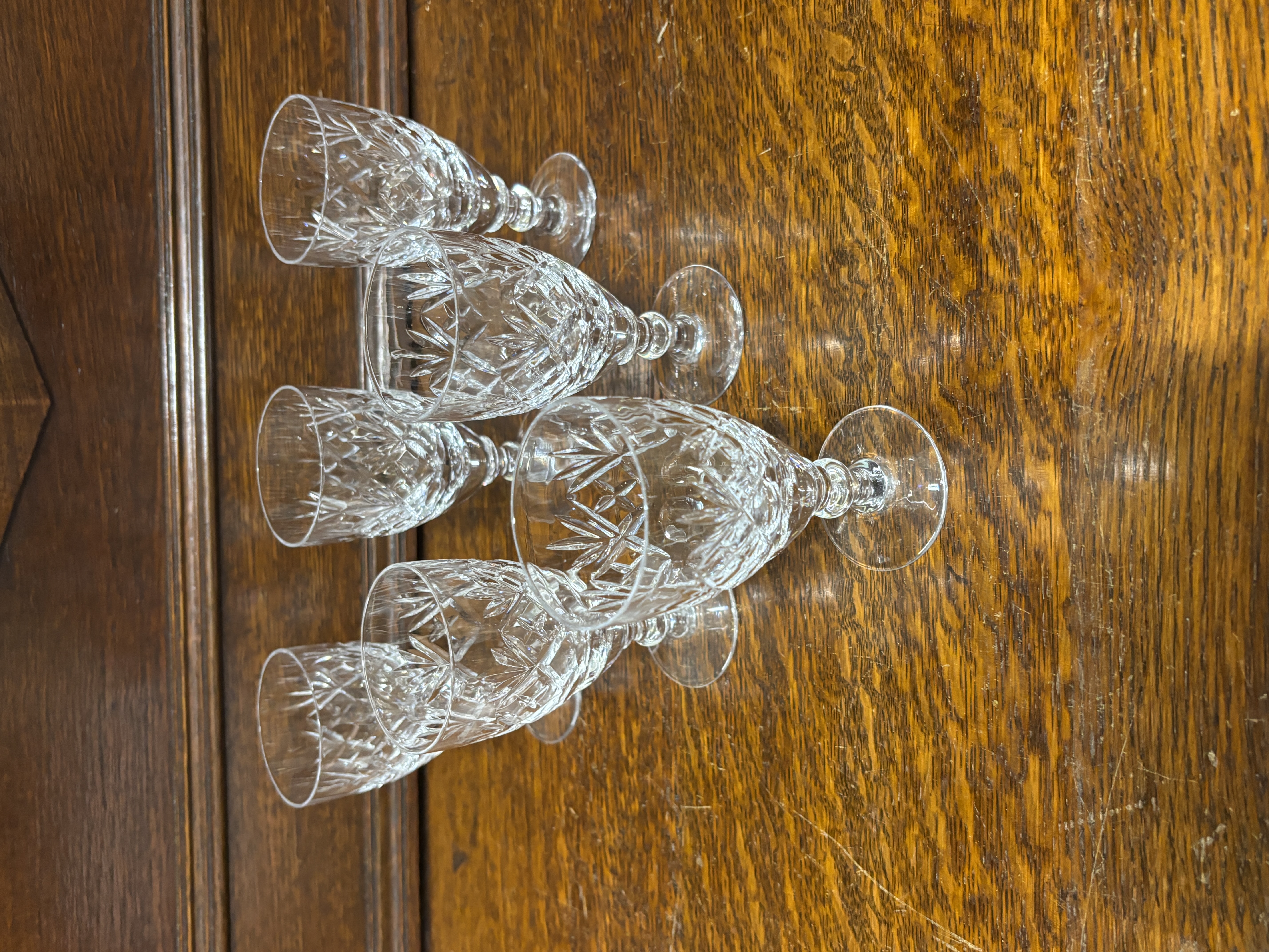 A Set of Cut Crystal Stemware Glasses in a Traditional Diamond and Fan Pattern
