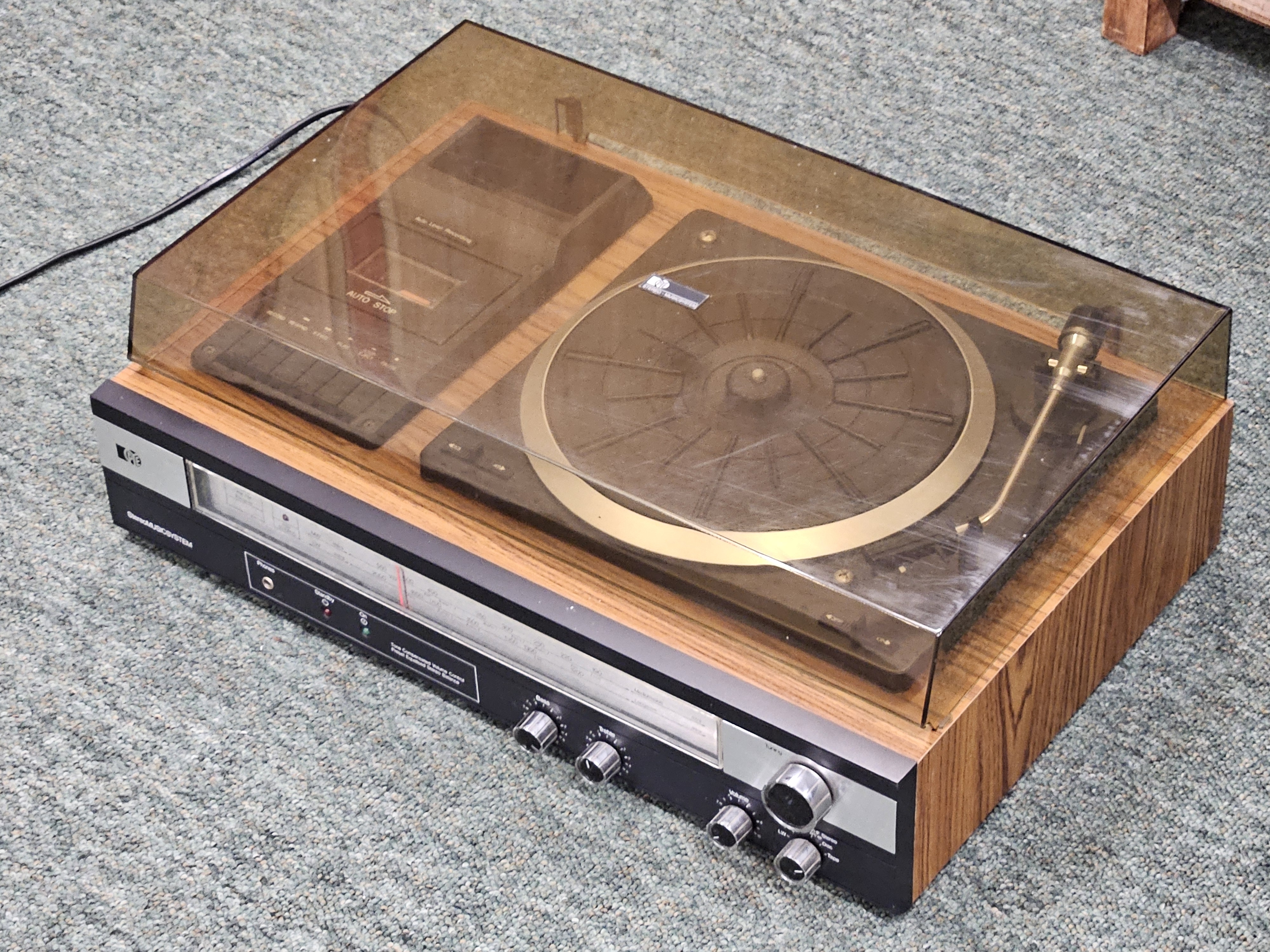A 1970's Pye stereo music centre, model 1629, retro tinted perspex lid over record deck, cassette, and radio tuner - no speakers