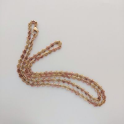 שרשרת זהב 14 קראט חתומה, חוליות מיוחדות זהב צהוב ואדום לסירוגין, משקל 14.70 גרם, אורך 73 ס"מ 