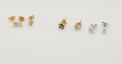 לוט של 7 עגילי זהב 14k משובצים יהלומים טבעיים במשקל כולל של כ 2ct , דגמי stud , גדלים וניקיונות 