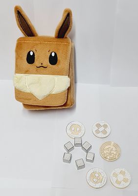 סט קוביות ומטבעות מתכת רשמיים של פוקימון עם תיק קשיח איבי.. מצב חדש